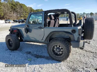 2014 Jeep Wrangler Sport z VIN 1C4AJWAG0EL119835, wystawiony jako Copart lot #88498755 z przebiegiem 151 756 mil mil oraz Szkoda całkowita • Salvage title. Historia ofert i sprzedaży dostępna na DreamBid. Obrazek 2.