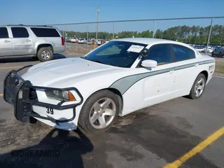 2014 Dodge Charger Police with VIN 2C3CDXAT8EH348719, listed as a IAAI auction lot 42026437 with 140,573 mi miles and . Bid and sale history available at DreamBid. Image 17.