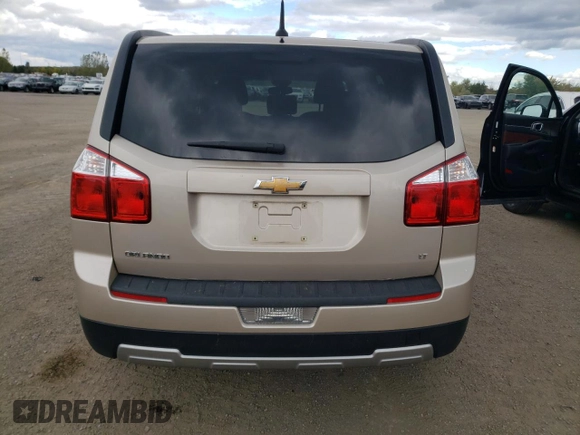 2012 Chevrolet Orlando 1LT z VIN KL77P2EMXCK561796, wystawiony jako Copart lot #75188244 z przebiegiem 131 868 mil mil oraz Tytuł czysty. Historia ofert i sprzedaży dostępna na DreamBid. Obrazek 6.