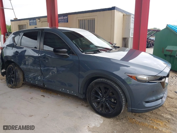 2021 Mazda CX-5 Touring with VIN JM3KFACM0M0327832, listed as a IAAI auction lot 41989199 with 42,396 mi miles. Bid and sale history available at carsss.com. Image 13.