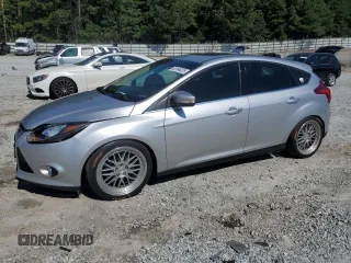 2014 Ford Focus Titanium with VIN 1FADP3N27EL409889, listed as a Copart auction lot 63164225 with 120,414 mi miles and Salvage title. Bid and sale history available at DreamBid. Image 1.