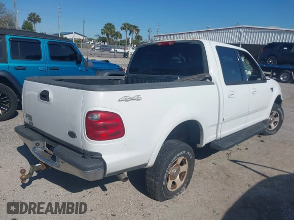 2002 Ford F-150 XLT with VIN 1FTRW08612KD90354, listed as a IAAI auction lot 41308528 with 207,261 mi miles. Bid and sale history available at carsss.com. Image 4.