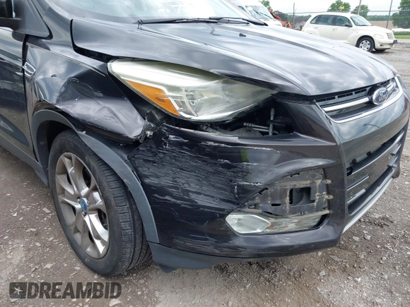 2013 Ford Escape SEL z VIN 1FMCU9H98DUB78564, wystawiony jako IAAI lot #42381290 z przebiegiem 89 728 mil mil oraz . Historia ofert i sprzedaży dostępna na DreamBid. Obrazek 6.