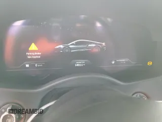 2020 McLaren GT z VIN SBM22GCA8LW000692, wystawiony jako Copart lot #44749324 z przebiegiem 18 911 mil mil oraz Nie do naprawy. Historia ofert i sprzedaży dostępna na DreamBid. Obrazek 9.