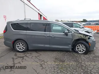 2021 Chrysler Pacifica Touring L with VIN 2C4RC1BG0MR543634, listed as a IAAI auction lot 41513467 with 148,010 mi miles and . Bid and sale history available at DreamBid. Image 13.