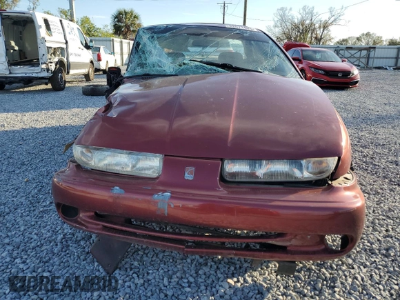 1999 Saturn SL z VIN 1G8ZK5278XZ173810, wystawiony jako Copart lot #42571425 z przebiegiem 114 580 mil mil oraz Szkoda całkowita • Salvage title. Historia ofert i sprzedaży dostępna na DreamBid. Obrazek 5.