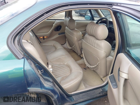 1996 Pontiac Bonneville z VIN 1G2HZ5210TH210829, wystawiony jako IAAI lot #41203888 z przebiegiem 154 990 mil mil oraz . Historia ofert i sprzedaży dostępna na DreamBid. Obrazek 8.