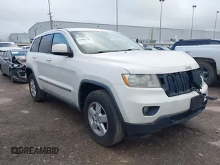 2012 Jeep Grand Cherokee Laredo with VIN 1C4RJFAG5CC224032, listed as a IAAI auction lot 42069334 with 106,614 mi miles. Bid and sale history available at carsss.com. Image 1.
