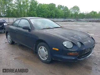 1995 Toyota Celica ST with VIN JT2AT00F7S0040443, listed as a IAAI auction lot 42125327 with 286,767 mi miles. Bid and sale history available at carsss.com. Image 1.