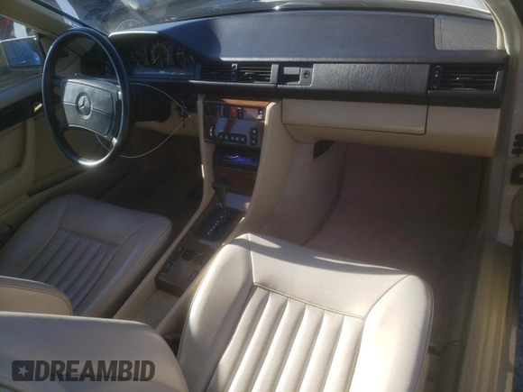 1988 Mercedes-Benz 300 with VIN WDBEA50D9JA698251, listed as a Copart auction lot 46977055 with 107,949 mi miles and Salvage Title. Bid and sale history available at DreamBid. Image 8.