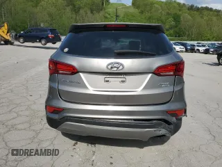 2018 Hyundai Santa Fe 2.4L z VIN 5NMZTDLB9JH079656, wystawiony jako Copart lot #54256175 z przebiegiem 100 678 mil mil oraz Szkoda całkowita • Salvage title. Historia ofert i sprzedaży dostępna na DreamBid. Obrazek 6.