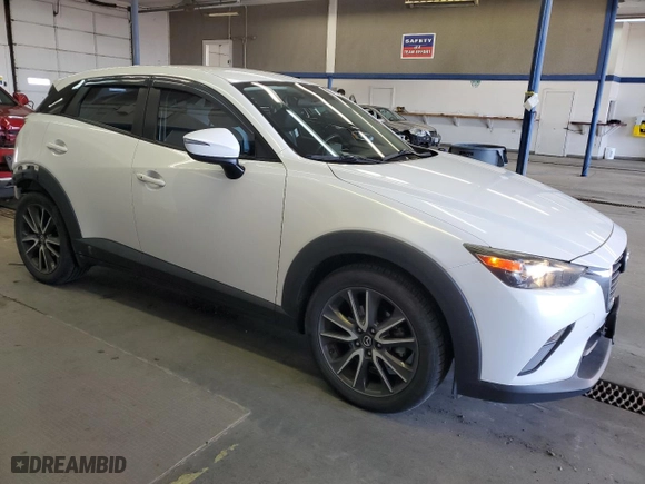 2017 Mazda CX-3 Touring with VIN JM1DKFC76H0148124, listed as a Copart auction lot 51866325 with 100,512 mi miles and Salvage Title. Bid and sale history available at carsss.com. Image 4.