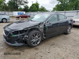 2014 Mazda 6 i Grand Touring с VIN JM1GJ1W68E1121860, выставлен на аукционе Copart как лот 56569715 с пробегом 98 206 миль миль и Списание • Salvage title. История ставок и продаж доступна на DreamBid. Изображение 1.