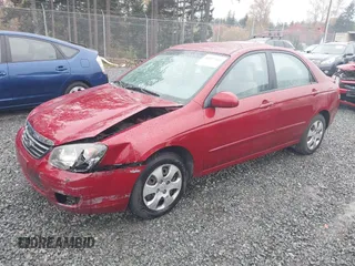 2009 Kia Spectra EX with VIN KNAFE222695621925, listed as a IAAI auction lot 40657622 with 135,647 mi miles. Bid and sale history available at carsss.com. Image 2.