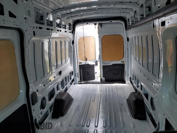 2024 Ford Transit Cargo z VIN 1FTBW3X85RKA98853, wystawiony jako Copart lot #60543695 z przebiegiem 26 182 mil mil oraz Szkoda całkowita • Salvage title. Historia ofert i sprzedaży dostępna na DreamBid. Obrazek 10.