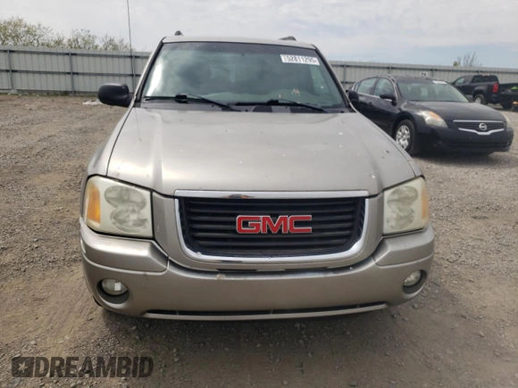 2003 GMC Envoy SLE z VIN 1GKDT13S332365071, wystawiony jako Copart lot #52811295 z przebiegiem Nie podano mil oraz Szkoda całkowita • Salvage title. Historia ofert i sprzedaży dostępna na DreamBid. Obrazek 5.