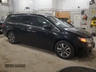 2014 Honda Odyssey Touring with VIN 5FNRL5H91EB128917, listed as a Copart auction lot 49353085 with 208,871 mi miles and Clean Title. Bid and sale history available at DreamBid. Image 4.