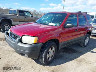 2003 Ford Escape XLT Popular with VIN 1FMYU03113KE12413, listed as a IAAI auction lot 41988476 with 157,817 mi miles. Bid and sale history available at carsss.com. Image 2.