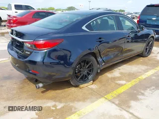 2015 Mazda 6 i Sport with VIN JM1GJ1U52F1201571, listed as a IAAI auction lot 42096344 with 88,290 mi miles and . Bid and sale history available at DreamBid. Image 4.