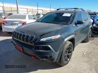 2017 Jeep Cherokee Trailhawk L Plus with VIN 1C4PJMBBXHW634944, listed as a IAAI auction lot 41022673 with 116,542 mi miles. Bid and sale history available at carsss.com. Image 2.