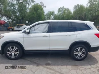 2016 Honda Pilot EX-L with VIN 5FNYF5H55GB015166, listed as a IAAI auction lot 42003009 with 142,488 mi miles and . Bid and sale history available at DreamBid. Image 13.