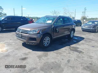 2014 Volkswagen Touareg Sport with VIN WVGEF9BP7ED003525, listed as a IAAI auction lot 41868307 with 74,379 mi miles and . Bid and sale history available at DreamBid. Image 17.