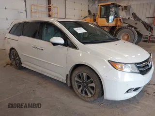 2015 Honda Odyssey with VIN 5FNRL5H97FB060060, listed as a IAAI auction lot 41829864 with Not Provided miles and . Bid and sale history available at DreamBid. Image 1.