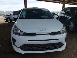 2023 Kia Rio S with VIN 3KPA24AD0PE616497, listed as a IAAI auction lot 41883848 with 8,717 mi miles. Bid and sale history available at carsss.com. Image 6.