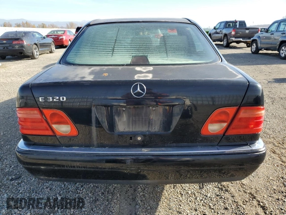 1997 Mercedes-Benz E-Class with VIN WDBJF55F5VJ028552, listed as a Copart auction lot 84172054 with 308,426 mi miles and Clean Title. Bid and sale history available at carsss.com. Image 6.