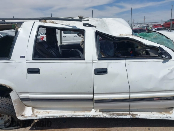 1999 GMC Suburban with VIN 1GDFK16R0XJ728255, listed as a IAAI auction lot 42230595 with Not provided miles and . Bid and sale history available at DreamBid. Image 13.
