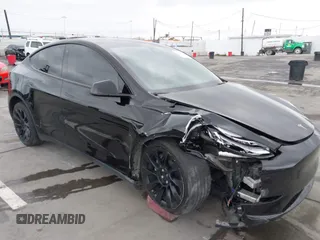 2022 Tesla Model Y Long Range z VIN 7SAYGDEE0NF508958, wystawiony jako IAAI lot #42191819 z przebiegiem 60 880 mil mil oraz . Historia ofert i sprzedaży dostępna na DreamBid. Obrazek 6.