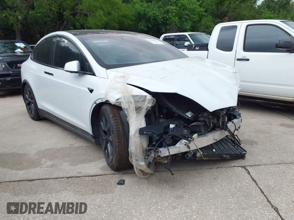 2024 Tesla Model X Plaid with VIN 7SAXCBE63RF440245, listed as a IAAI auction lot 42140051 with Not Provided miles and . Bid and sale history available at DreamBid. Image 1.