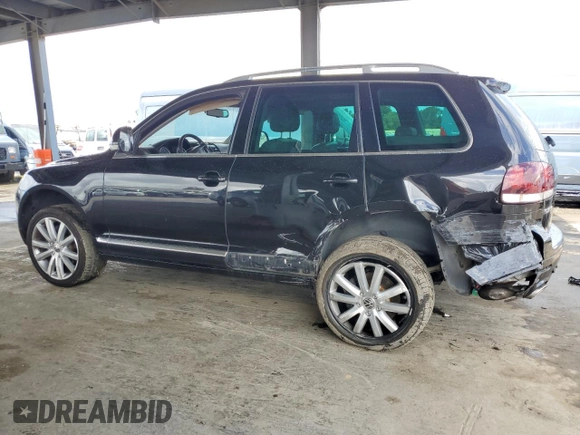 2010 Volkswagen Touareg VR6 with VIN WVGBF7A98AD001321, listed as a Copart auction lot 48949685 with 101,944 mi miles and Salvage Title. Bid and sale history available at DreamBid. Image 2.