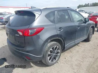 2016 Mazda CX-5 Grand Touring with VIN JM3KE4DY9G0845707, listed as a IAAI auction lot 41709685 with 96,351 mi miles. Bid and sale history available at carsss.com. Image 4.