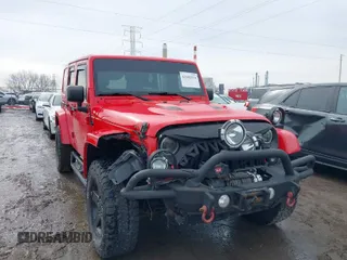 2015 Jeep Wrangler Unlimited Sahara with VIN 1C4BJWEG3FL590491, listed as a IAAI auction lot 41642219 with 148,759 mi miles. Bid and sale history available at carsss.com. Image 1.
