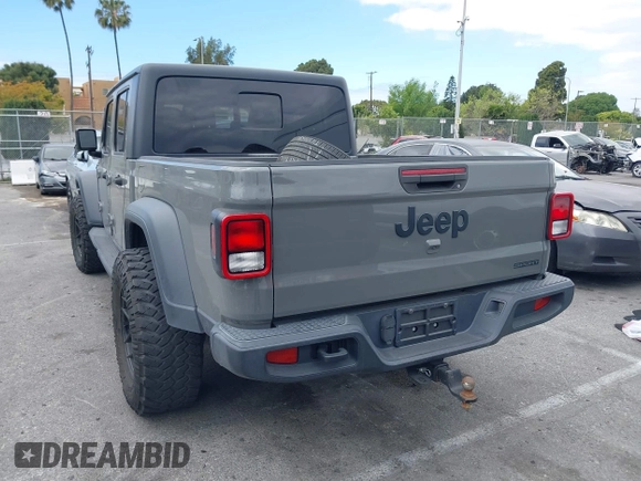 2020 Jeep Gladiator Sport S z VIN 1C6HJTAG4LL153441, wystawiony jako IAAI lot #42052329 z przebiegiem 34 660 mil mil oraz . Historia ofert i sprzedaży dostępna na DreamBid. Obrazek 3.