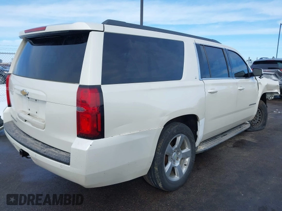 2015 Chevrolet Suburban LT with VIN 1GNSKJKC0FR309866, listed as a IAAI auction lot 41743848 with 220,778 mi miles and . Bid and sale history available at DreamBid. Image 4.