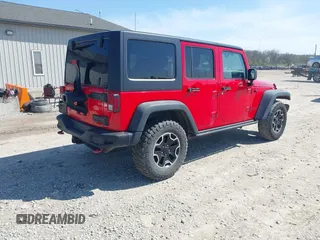2015 Jeep Wrangler Unlimited Rubicon Hard Rock with VIN 1C4HJWFG9FL525556, listed as a IAAI auction lot 41973576 with 246,949 mi miles and . Bid and sale history available at DreamBid. Image 4.