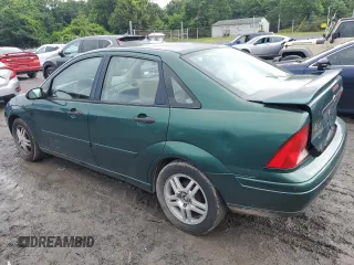 2000 Ford Focus SE with VIN 1FAFP3433YW354797, listed as a Copart auction lot 61430265 with 165,202 mi miles and Salvage title. Bid and sale history available at DreamBid. Image 2.