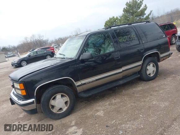 1998 GMC Yukon with VIN 1GKEK13R9WJ734112, listed as a IAAI auction lot 42072548 with 226,061 mi miles. Bid and sale history available at carsss.com. Image 2.