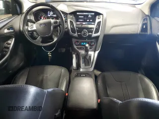 2014 Ford Focus Titanium with VIN 1FADP3N2XEL131392, listed as a Copart auction lot 61665025 with 105,597 mi miles and Salvage title. Bid and sale history available at DreamBid. Image 8.