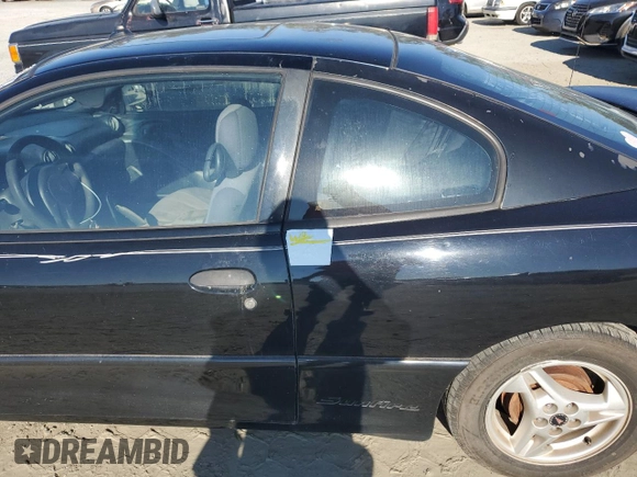 2005 Pontiac Sunfire z VIN 3G2JB12F95S220733, wystawiony jako Copart lot #74266014 z przebiegiem 208 749 mil mil oraz Szkoda całkowita • Salvage title. Historia ofert i sprzedaży dostępna na DreamBid. Obrazek 12.