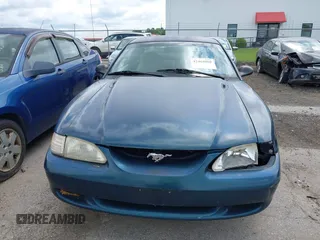 1996 Ford Mustang GT z VIN 1FALP42XXTF137304, wystawiony jako IAAI lot #42464808 z przebiegiem 166 565 mil mil oraz . Historia ofert i sprzedaży dostępna na DreamBid. Obrazek 13.