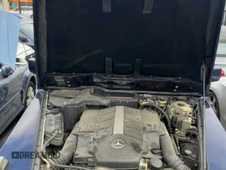 2002 Mercedes-Benz G with VIN WDCYR49E72X133986, listed as a Copart auction lot 54624435 with 138,597 mi miles and Salvage Title. Bid and sale history available at carsss.com. Image 7.