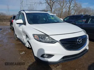 2015 Mazda CX-9 Touring z VIN JM3TB3CA6F0448241, wystawiony jako IAAI lot #41467051 z przebiegiem 79 058 mil mil oraz . Historia ofert i sprzedaży dostępna na DreamBid. Obrazek 1.