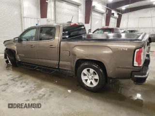 2015 GMC Canyon 4WD SLE z VIN 1GTG6BE3XF1242163, wystawiony jako Copart lot #57132035 z przebiegiem 110 241 mil mil oraz Szkoda całkowita • Salvage title. Historia ofert i sprzedaży dostępna na DreamBid. Obrazek 2.