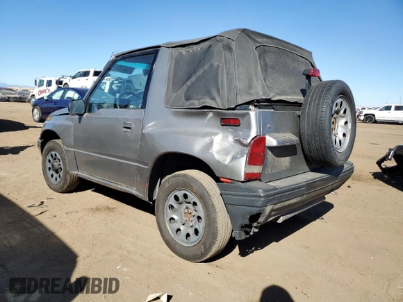 1995 Chevrolet Tracker z VIN 2CNBJ186XS6926688, wystawiony jako Copart lot #77487204 z przebiegiem 17 598 mil mil oraz Szkoda całkowita • Salvage title. Historia ofert i sprzedaży dostępna na DreamBid. Obrazek 2.
