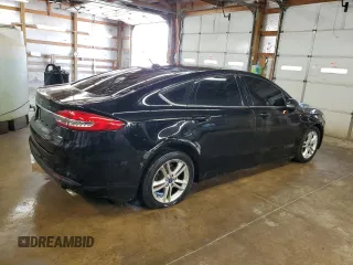 2018 Ford Fusion SE z VIN 3FA6P0H77JR277923, wystawiony jako Copart lot #56897455 z przebiegiem 154 432 mil mil oraz Czysty tytuł • Clean title. Historia ofert i sprzedaży dostępna na DreamBid. Obrazek 3.