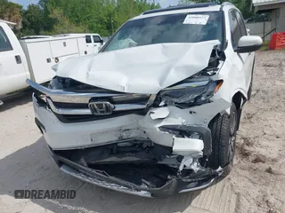 2022 Honda Pilot Touring 7-Passenger z VIN 5FNYF5H67NB027356, wystawiony jako IAAI lot #42080323 z przebiegiem 56 826 mil mil oraz . Historia ofert i sprzedaży dostępna na DreamBid. Obrazek 6.
