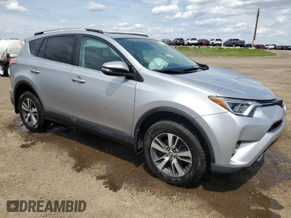 2016 Toyota RAV4 XLE with VIN 2T3RFREV9GW439315, listed as a Copart auction lot 59704345 with 143,198 mi miles and Salvage title. Bid and sale history available at DreamBid. Image 4.